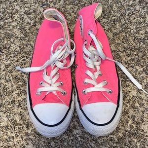 Bright pink high top converse